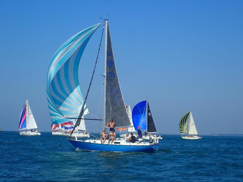 Sunbathing on Assent during the Round the Island Race 2026 - photo © Clive Hughes