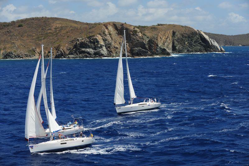 Bareboats round Norman Island during the 2014 BVI Spring Regatta and Sailing Festival photo copyright Todd van Sickle / BVI Spring Regatt taken at Royal BVI Yacht Club and featuring the Cruising Yacht class
