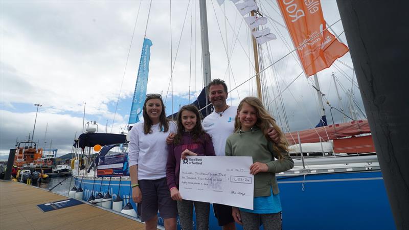 Skipper Mark and Mate Hannah with Georgie and Effie as they present their cheque to the Ellen MacArthur Cancer Trust in Inverness having raised over £1400 cartwheeling across every beach on mainland Orkney - photo © Ellen MacArthur Cancer Trust