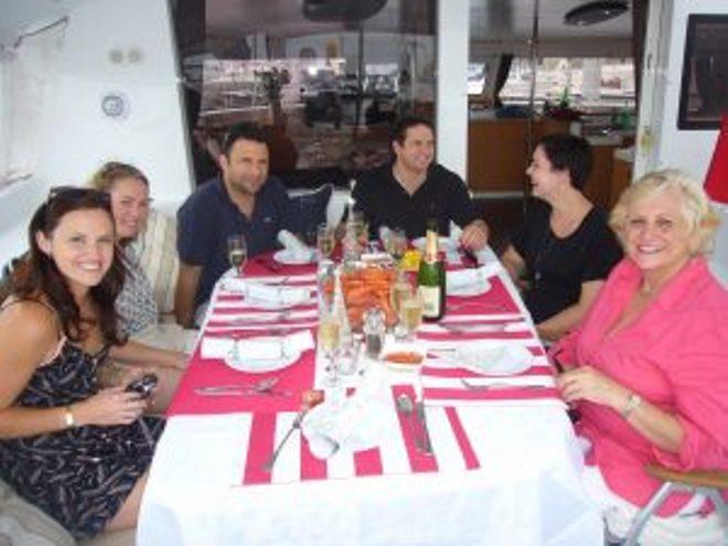 The Fraser family enjoying Christmas lunch afloat (from left): Daughter Fiona and DIL Lucinda, sons Scott and Tom and DIL Lauren, and Louise. (Gordon is not in shot as he is the photographer.) - photo © Gordon Fraser