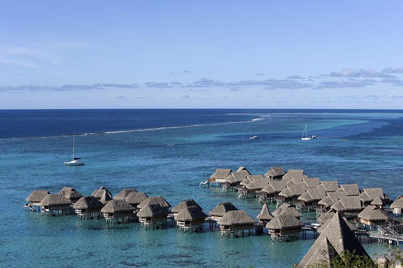 Overwater bungalows a part of the experience - Photo tour through Tahiti with Andrea Francolini photo copyright Andrea Francolini taken at  and featuring the Cruising Yacht class
