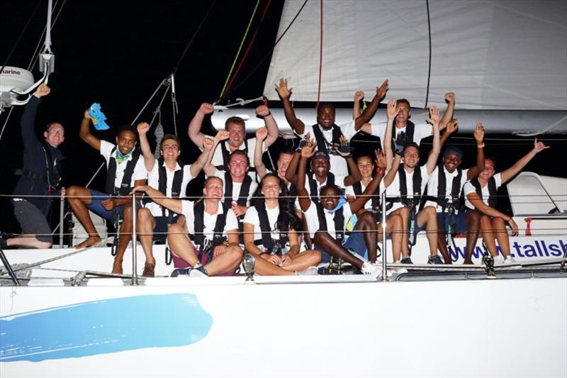 Cheers from the ARC Youth Team on Challenger 1 crossing the ARC Finish line on Wednesday 12 December, at 20:19:01 photo copyright Tim Wright / photoaction.com taken at  and featuring the Cruising Yacht class