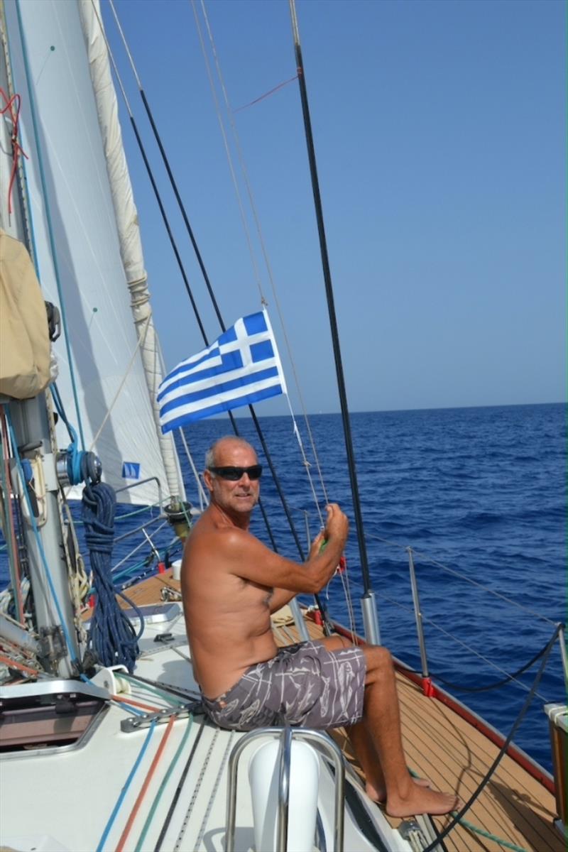 Raising the Greek Flag photo copyright SV Red Roo taken at  and featuring the Cruising Yacht class