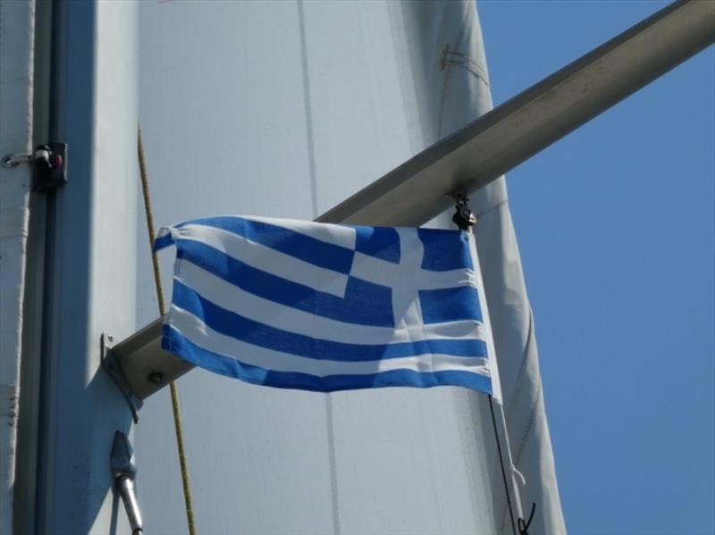Raising the Greek Flag photo copyright SV Red Roo taken at  and featuring the Cruising Yacht class