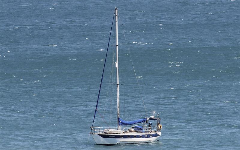 Wind generator whirring away making the most of the stiff 25 knot SE Trade Winds - photo © John Curnow