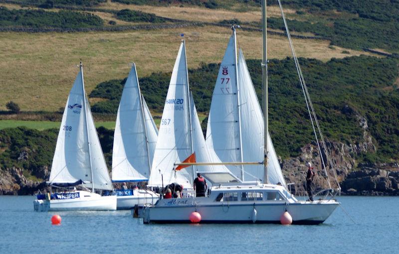 Larger cruiser yacht race getting underway with the Race Committee on “Alicat” the Committee boat at anchor, one end of the start line at Kippford Week 2022 photo copyright Becky Davison taken at Solway Yacht Club and featuring the Cruising Yacht class