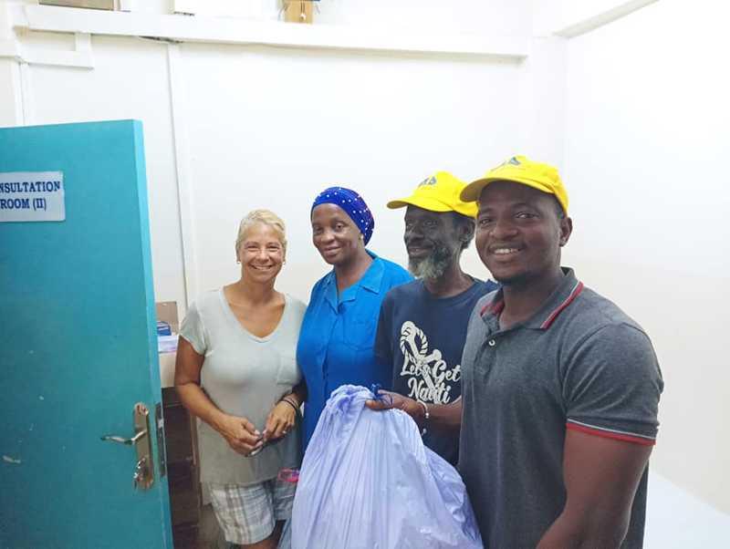 Accepting the meds from the clinic was Eliza King, along with Sey Samba, the OCC port captain in Gambia and Mohammed Keata, OCC member and check-in agent here in Banjul. Lori Muller on the left photo copyright Paul & Lori Muller taken at  and featuring the Cruising Yacht class