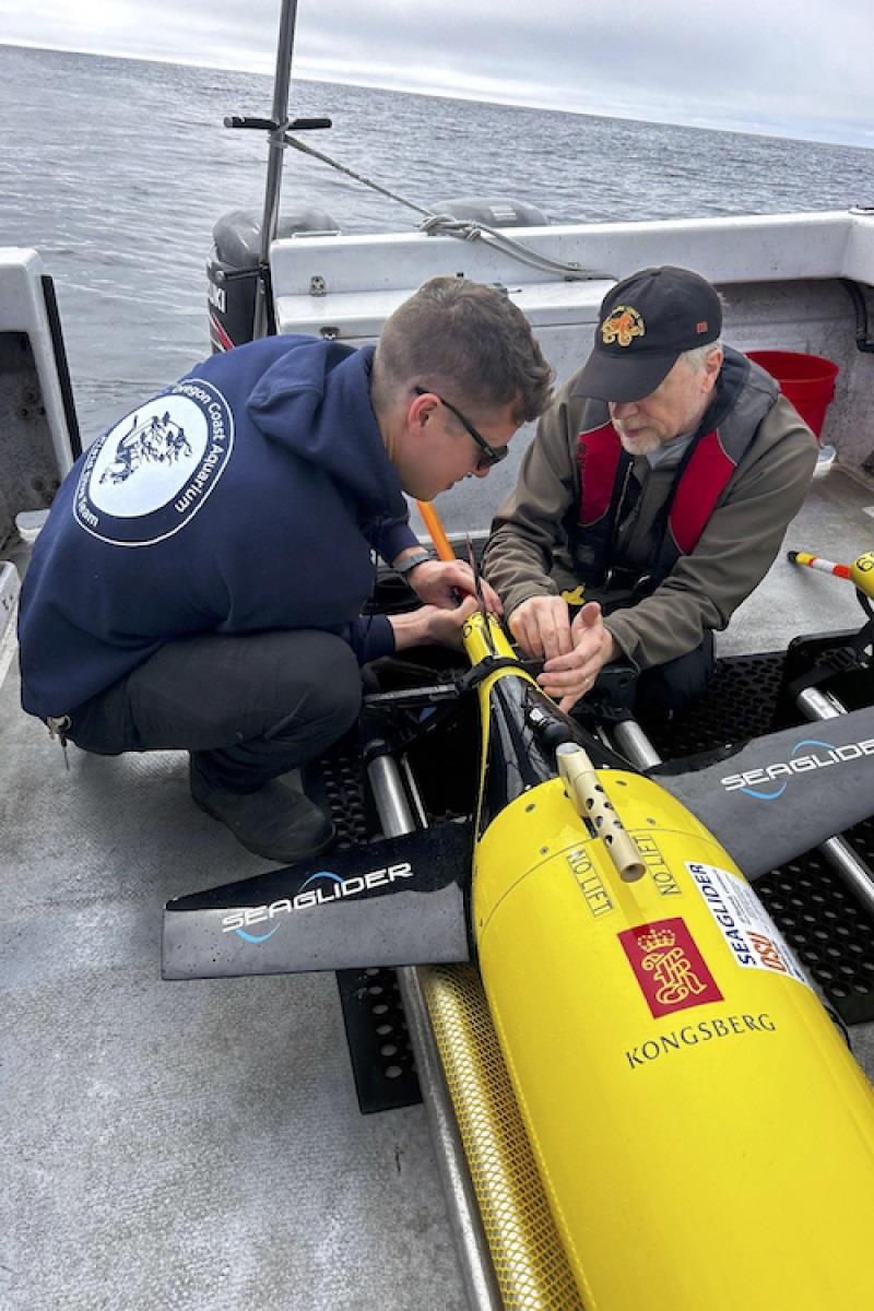 Oregon State University professor David Mellinger and Doug Batson from the Oregon Coast Aquarium prepare the Seagliders for deployment off the coast of Oregon in mid-September. They were aboard the Oregon Coast Aquarium's vessel, the R/V Gracie Lynn photo copyright Genece Grisby, Oregon Coast Aquarium taken at  and featuring the Cruising Yacht class