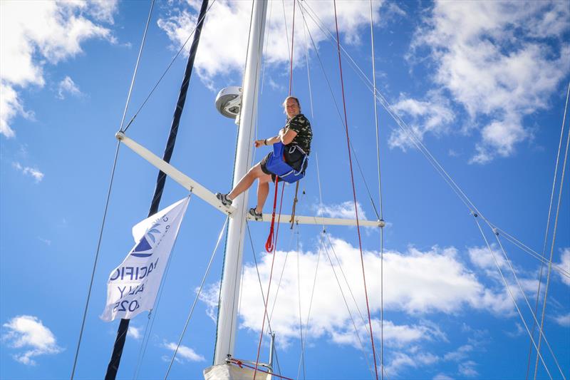 Emily Rudkin - our fleet rigger up the mast - Pacific Rally 2025 - photo © Jacob Fewtrell Media