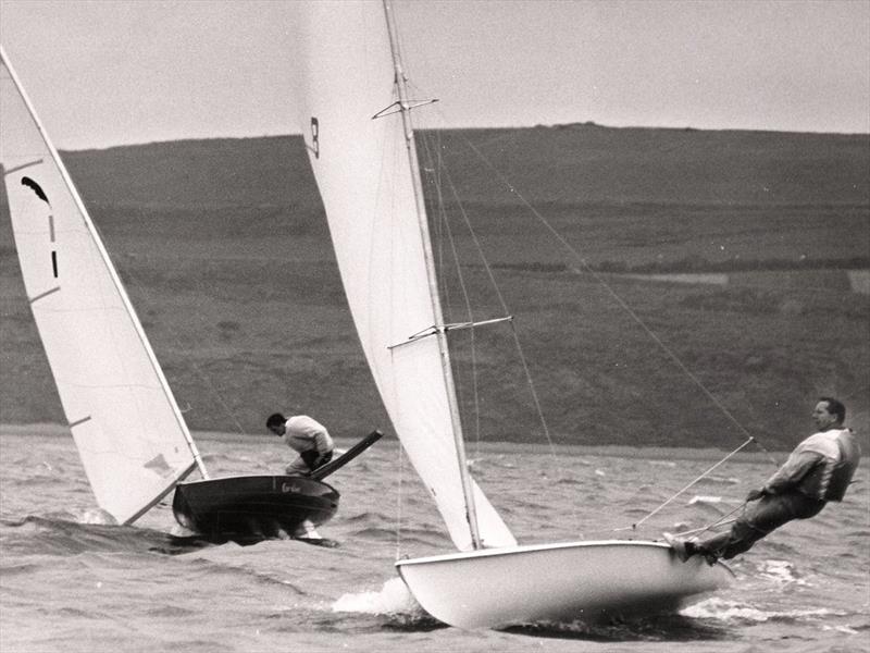 The present is shown the future!  Jack Holt's first entry for Weymouth, the pretty (but only 14ft long) Cavalier, complete with sliding seat, was outclassed by Paul Elvstrom on his Trapez - photo © David Thomas