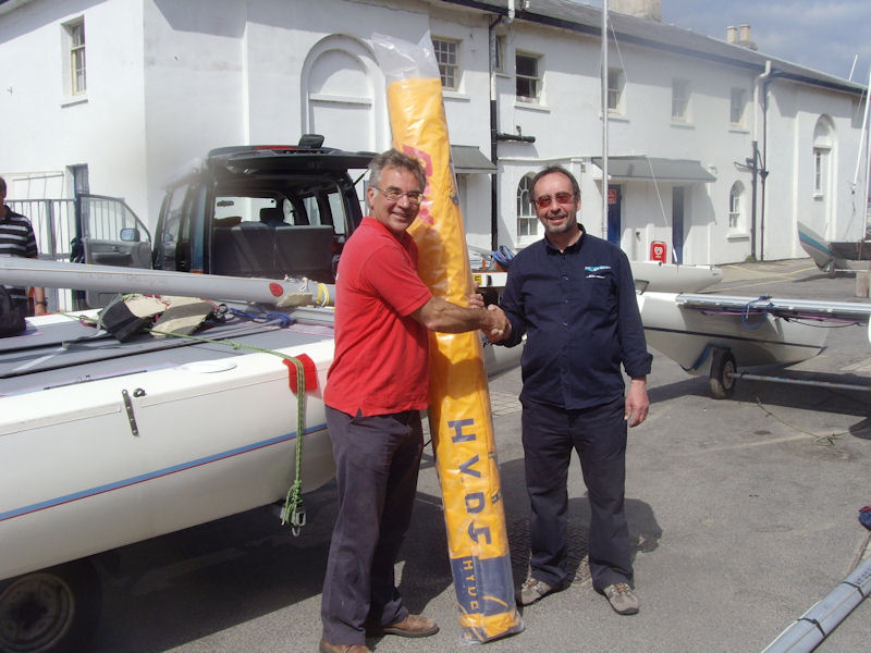 Brian Phipps presents George Love with a new mainsail for his Sprint 15 photo copyright Nick Dewhirst taken at Swanage Sailing Club and featuring the Dart 15 class