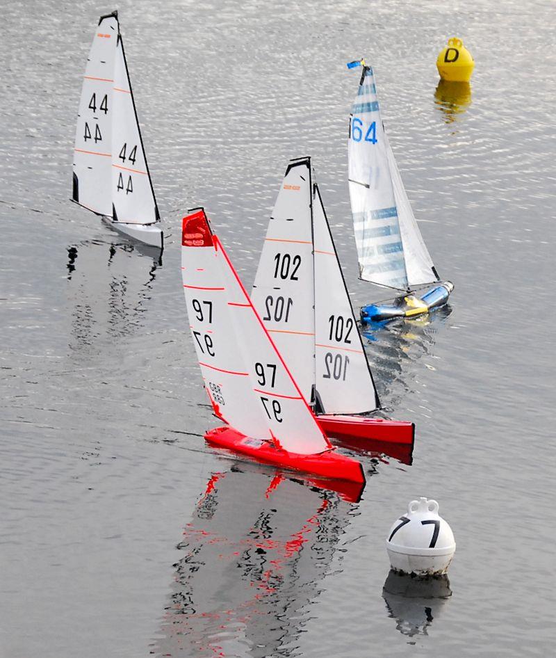 Nathan Stollery (BOTTLE boat 164) gets the best start ahead of the DF95s in the Brass Monkey event at Abbey Meads Lake photo copyright GMYC taken at Guildford Model Yacht Club and featuring the DF95 class