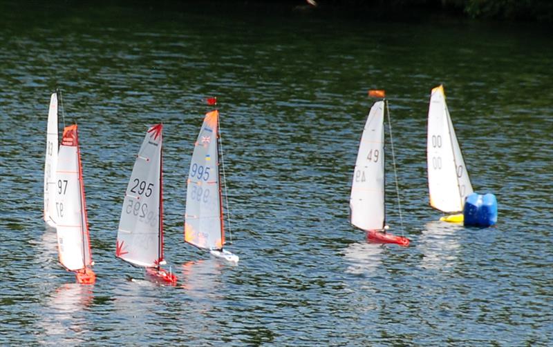 The fleet going through the leeward gate during the 2022 DF95 Ash Trophy at Abbey Meads photo copyright Roger Stollery taken at Guildford Model Yacht Club and featuring the DF95 class