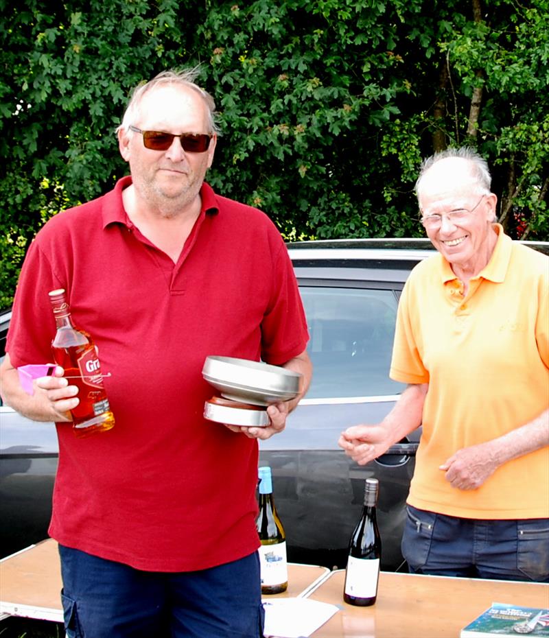 Buzz Coleman receiving his trophy and prizes with Race Officer Roger Stollery during the 2022 DF95 Ash Trophy at Abbey Meads photo copyright Roger Stollery taken at Guildford Model Yacht Club and featuring the DF95 class