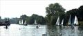 Swans, sails and a Mississipi style paddle steamer – this could only be the Thames. Minima competitors hugging the west bank at Kingstonat the Minima Regatta © Rob Mayley