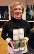 © Frank Miller Marie Barry picks up her Tyrconnell Whiskey – courtesy of the Howth Fireball Worlds 2020 sponsor - Dun Laoghaire Motor Yacht Club Frostbite Series © Frank Miller