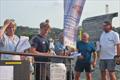 Henry Powell, Martin Wood and Iain Wilson collecting silverware - Cardigan Bay Regatta at New Quay YC © Tilly Andrews