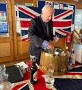 Ex-Navy Sailing Club Member Dave Perrin serves winter warmers after the Remembrance Day Service at Bexhill