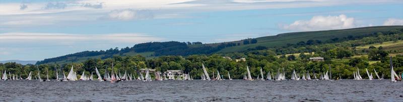 The Birkett fleet sails past the Sharrow Bay Hotel photo copyright Tim Olin / www.olinphoto.co.uk taken at Ullswater Yacht Club and featuring the Dinghy class