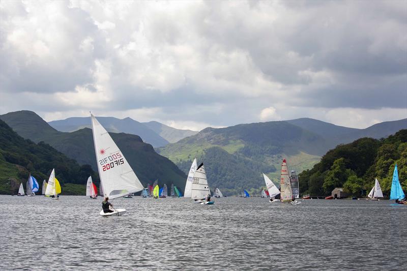 Boats racing on Ullswater at the Birkett in July photo copyright Tim Olin / www.olinphoto.co.uk taken at Ullswater Yacht Club and featuring the Dinghy class