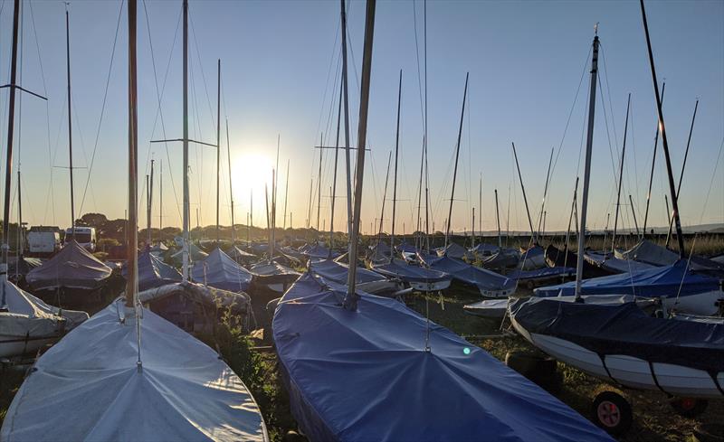 Boats looking forward to having their covers off photo copyright Mark Jardine taken at Keyhaven Yacht Club and featuring the Dinghy class