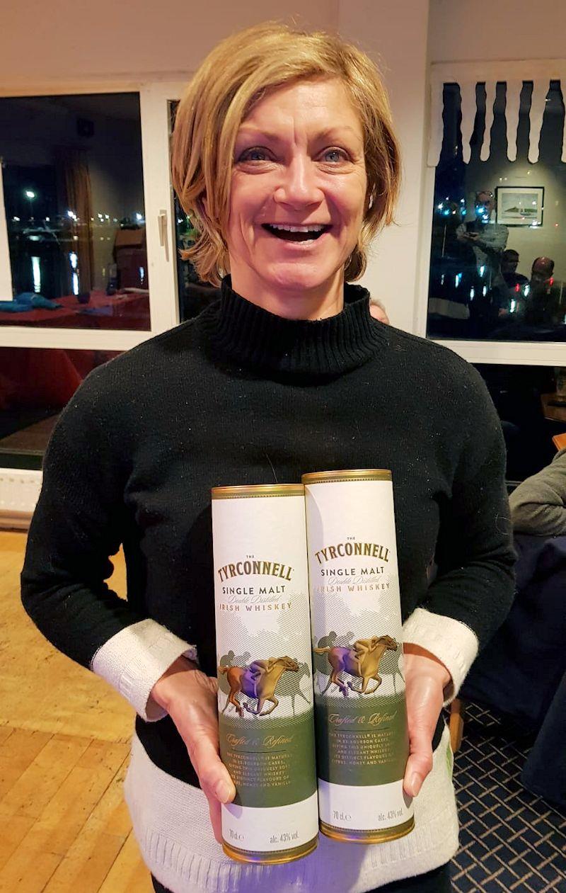 Marie Barry picks up her Tyrconnell Whiskey – courtesy of the Howth Fireball Worlds 2020 sponsor - Dun Laoghaire Motor Yacht Club Frostbite Series photo copyright Frank Miller taken at Dun Laoghaire Motor Yacht Club and featuring the Dinghy class