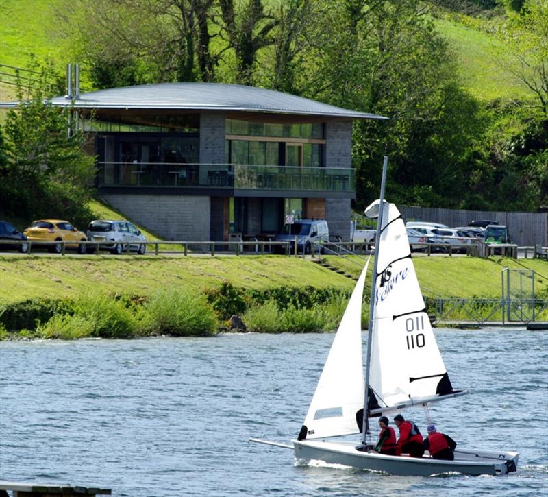 Mike Holgate passing the Llandegfedd Reservoir Visitor Center on Llandegfedd Sailing Club Push the Boat Out photo copyright RYA Cymru Wales taken at Llandegfedd Sailing Club and featuring the Dinghy class