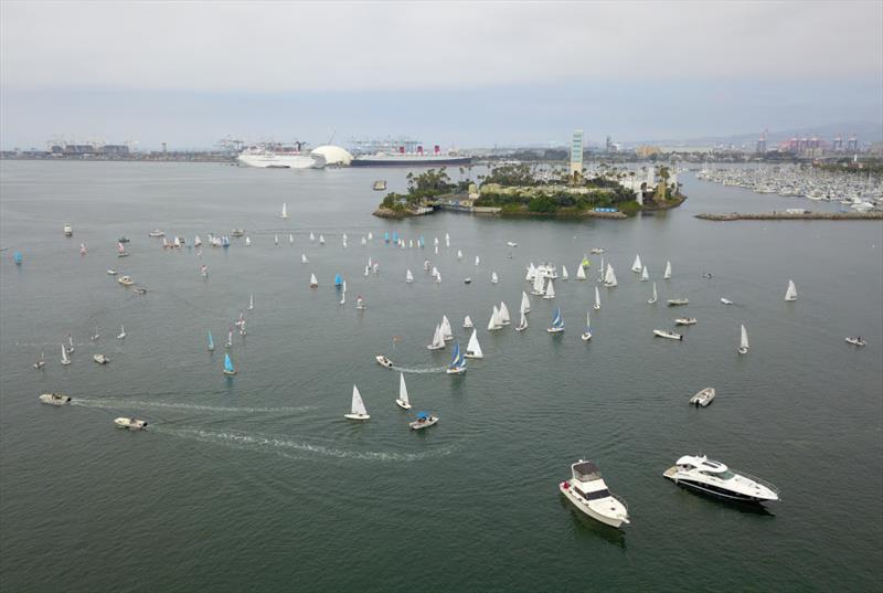Race is underway, the small sails dotting the waters just outside Alamitos Bay photo copyright Cameron MacLaren taken at Long Beach Yacht Club and featuring the Dinghy class