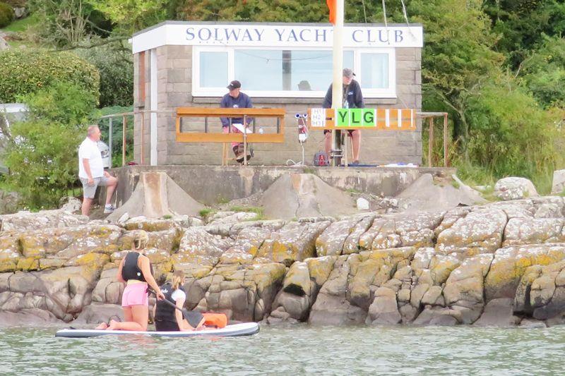 The challenges of the Race Committee - Duncan Gillespie and Lindsay Tosh had enough on their minds before distractions from paddle boarders and spectators - Kippford RNLI Regatta Day at Solway YC photo copyright John Sproat taken at Solway Yacht Club and featuring the Dinghy class