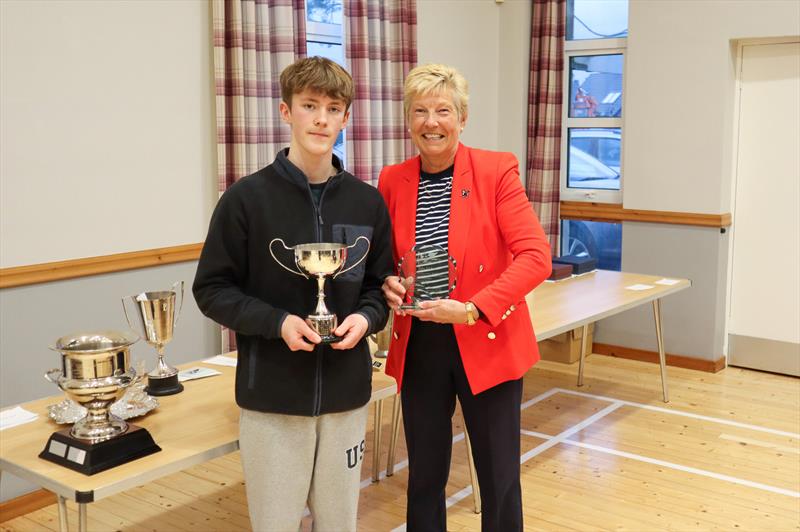 Social Secretary, Liz Train presents Toby Iglehart with the Tordoff Cup, 2025 Club Champion photo copyright Nicola McColm taken at Solway Yacht Club and featuring the Dinghy class