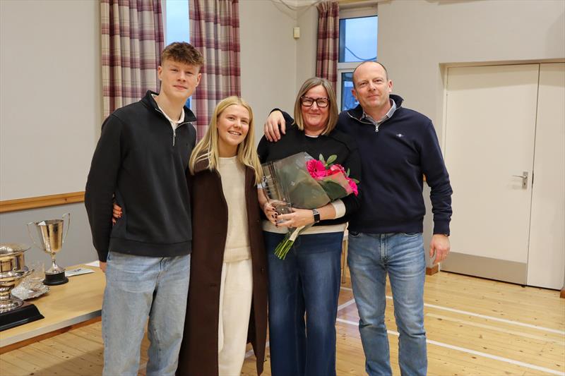 Solway YC's Cadet Officer (2028-2025) with her award, flanked by son Finn, daughter Katie and joined by husband Mark photo copyright Nicola McColm taken at Solway Yacht Club and featuring the Dinghy class