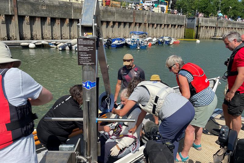 Hoisting a wheelchair user into a rowing gig - Disability Awareness Day in Dartmouth photo copyright Dart Harbour & Navigation Authority taken at  and featuring the Disabled class