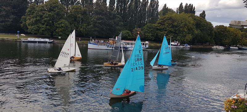 Cats paws show the windy patches at the Minima Yacht Club Annual Regatta 2019: Alex Cane's Enterprise heads for the finish in the final race clinching the trophy ahead of John Forbes and (partly hidden) Rob Brignell photo copyright Paul Bloomfield taken at Minima Yacht Club and featuring the Enterprise class