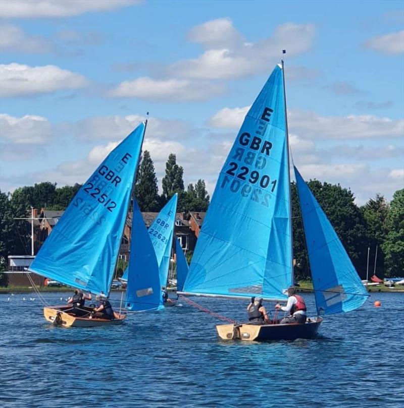 The fleet head downwind during the Midland Enterprise Open photo copyright Naomi Guest taken at Midland Sailing Club and featuring the Enterprise class