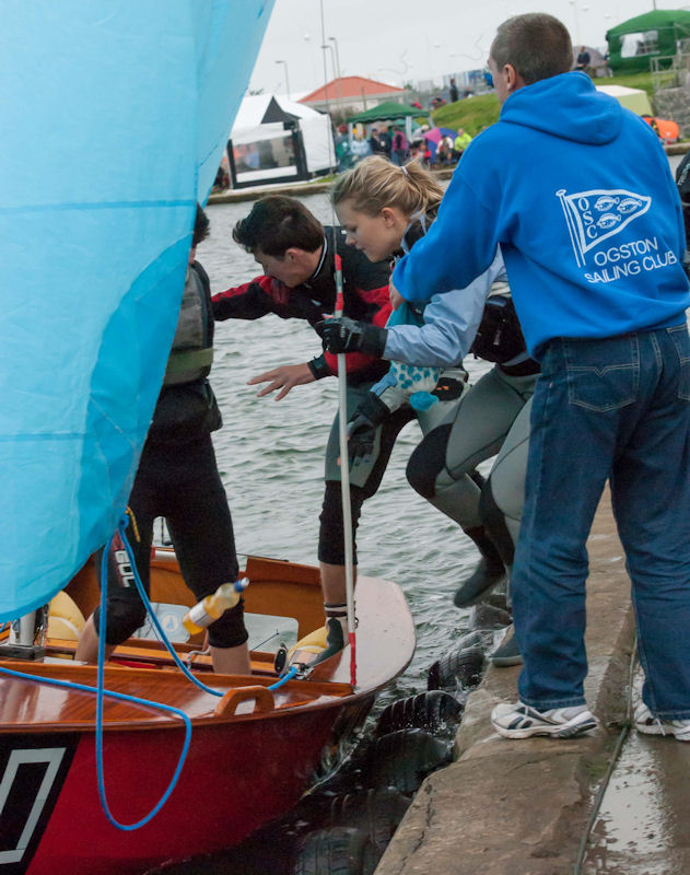 The new crew leap into Ogston Sailing Club's boat in the docking area during the 24 Hour Race held at West Lancs photo copyright Kit Robinson taken at West Lancashire Yacht Club and featuring the Enterprise class