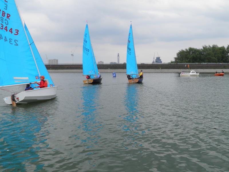 Paul Young and Jan Kimber 22901 take the lead at the finish of race 2 of the 2023 Enterprise Midland Area Double Chine Series at Midland SC photo copyright Kevin Hopkins taken at Midland Sailing Club and featuring the Enterprise class