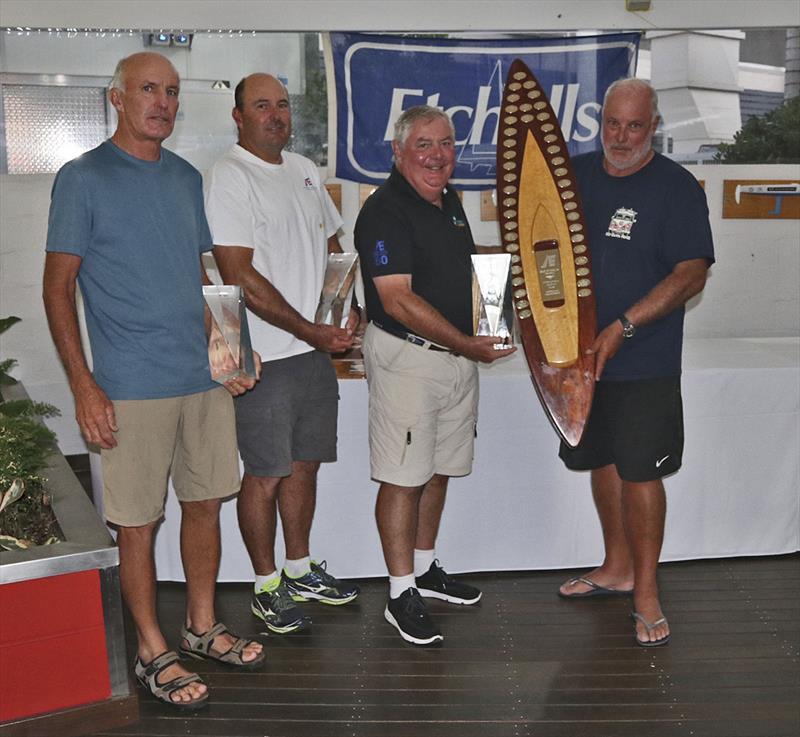 RQYS Commodore presents Iain Murray, Richie Allanson and Colin Beashel with their loot for winning the 2019 Etchells Australian Championship photo copyright John Curnow taken at Royal Queensland Yacht Squadron and featuring the Etchells class