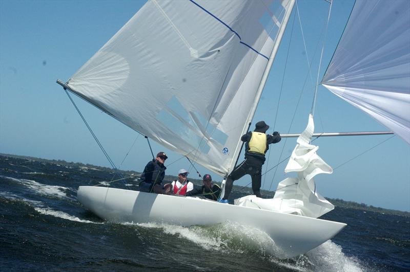 The crew of Go With The Flow drop the spinnaker as they speed towards the finish line. At the end of day one, with three races completed, Go With The Flow is currently the series leader in the Etchells Class photo copyright Jeanette Severs taken at Metung Yacht Club and featuring the Etchells class