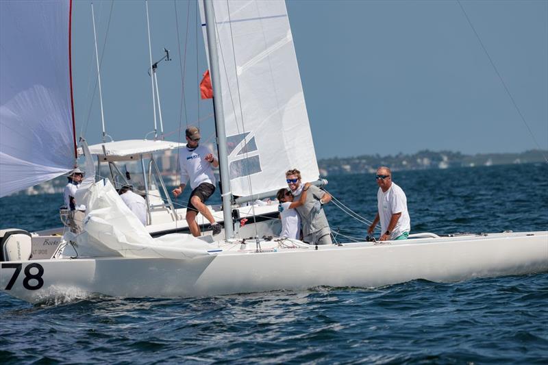 Mid-Winter Champions celebrate across the line: Marvin Beckmann and his crew on The Martian (USA1378), Tommy Dietrich, Arantxa Agribay, and Joachim Aschenbrenner - 2022/2023 Etchells Biscayne Bay Series - Mid-Winter East Regatta photo copyright Nic Brunk taken at Biscayne Bay Yacht Club and featuring the Etchells class
