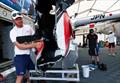 Nathan Outteridge, CEO & driver of Japan SailGP Team, looks at the damage to the F50 catamaran caused by a collision with Great Britain SailGP Team, on Race Day 2. Australia Sail Grand Prix © Patrick Hamilton/SailGP