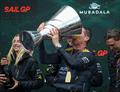 Tom Slingsby, CEO and driver of Australia SailGP Team, drinks Champagne Barons de Rothschild from the Sail Grand Prix Championship Trophy
