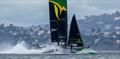 Australia SailGP Team helmed by Tom Slingsby dips one of their hulls into a wave on Race Day 2 of San Francisco SailGP, Season 2