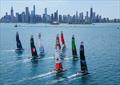 The SailGP F50 catamaran fleet sail towards the Chicago skyline and Navy Pier on Race Day 2  - T-Mobile United States Sail Grand Prix, Chicago at Navy Pier, Lake Michigan, Season 3 © Simon Bruty/SailGP