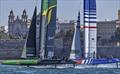 Australia SailGP Team helmed by Tom Slingsby and France SailGP Team helmed by Quentin Delapierre sail past the Cadiz Cathedral on Race Day 1 of the Spain Sail Grand Prix in Cadiz, Andalusia, Spain. 24th September