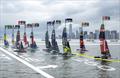Spain SailGP Team helmed by Diego Botin leads the SailGP Fleet of F50 catamaran past the New York City skyline and One World Trade Centre on Race Day 1 of the Mubadala New York Sail Grand Prix