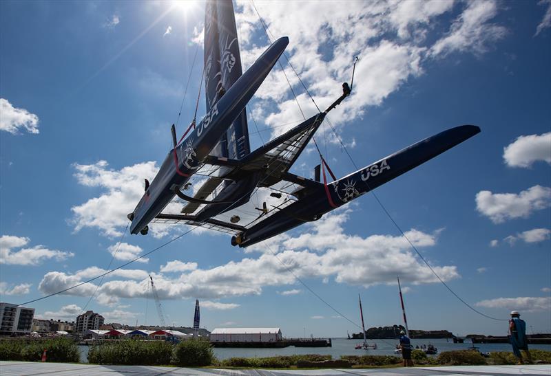 USA SailGP shore team lifting the F50 catamaran onto the water for a practice session ahead of Great Britain SailGP, Event 3, Season 2 in Plymouth photo copyright Ian Roman for SailGP taken at  and featuring the F50 class
