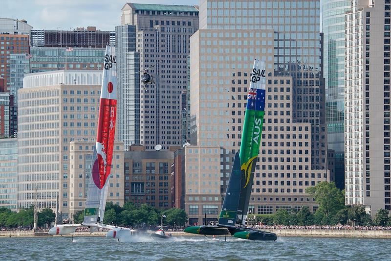 Japan SailGP Team skippered by Nathan Outteridge and Australia SailGP Team skippered by Tom Slingsby racing in the Match Race with a media helicopter behind. Race Day 2 Event 3 Season 1 SailGP event in New York City, New York, United States. 22 June  photo copyright Bob Martin for SailGP taken at  and featuring the F50 class