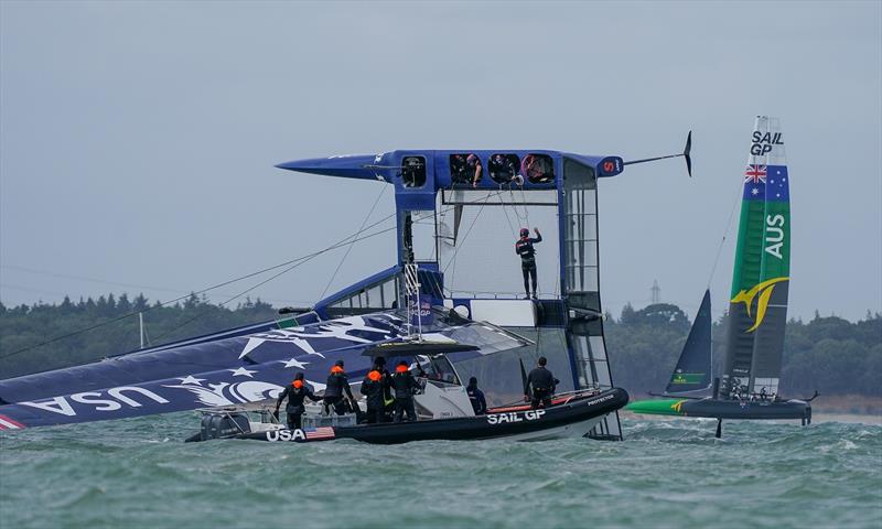 United States SailGP Team F50 catamaran capsized during the first race in high winds on Race Day. Event 4 Season 1 SailGP event in Cowes, Isle of Wight, England, United Kingdom photo copyright Bob Martin for SailGP taken at  and featuring the F50 class