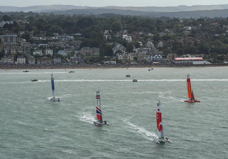 Japan SailGP Team leads Great Britain SailGP Team during the first race. Race Day - Cowes, Day 2, August 11, 2019 photo copyright Thomas Lovelock for SailGP taken at  and featuring the F50 class