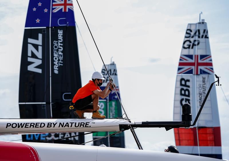 A member of the Japan SailGP Team make adjustments to their team F50 after it has been craned onto the water on Race Day 2 at the Cross Island Technical Base.  - photo © Thomas Lovelock/SailGP